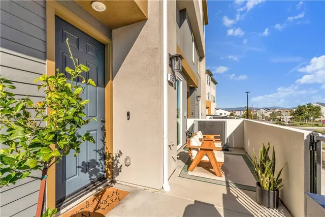 a picture of a room with wooden floor and a mirror