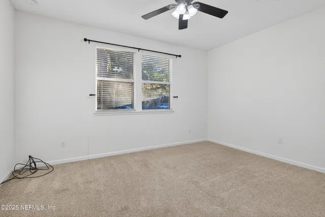 a bathroom with a shower and a toilet