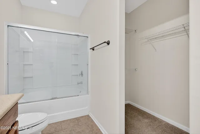 an empty room with closet area