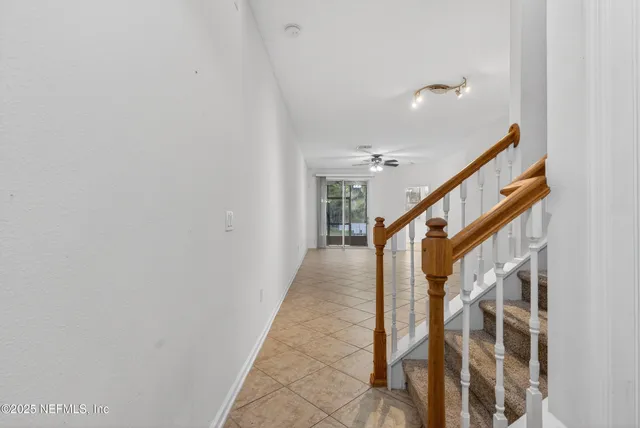 a kitchen with granite countertop cabinets and refrigerator