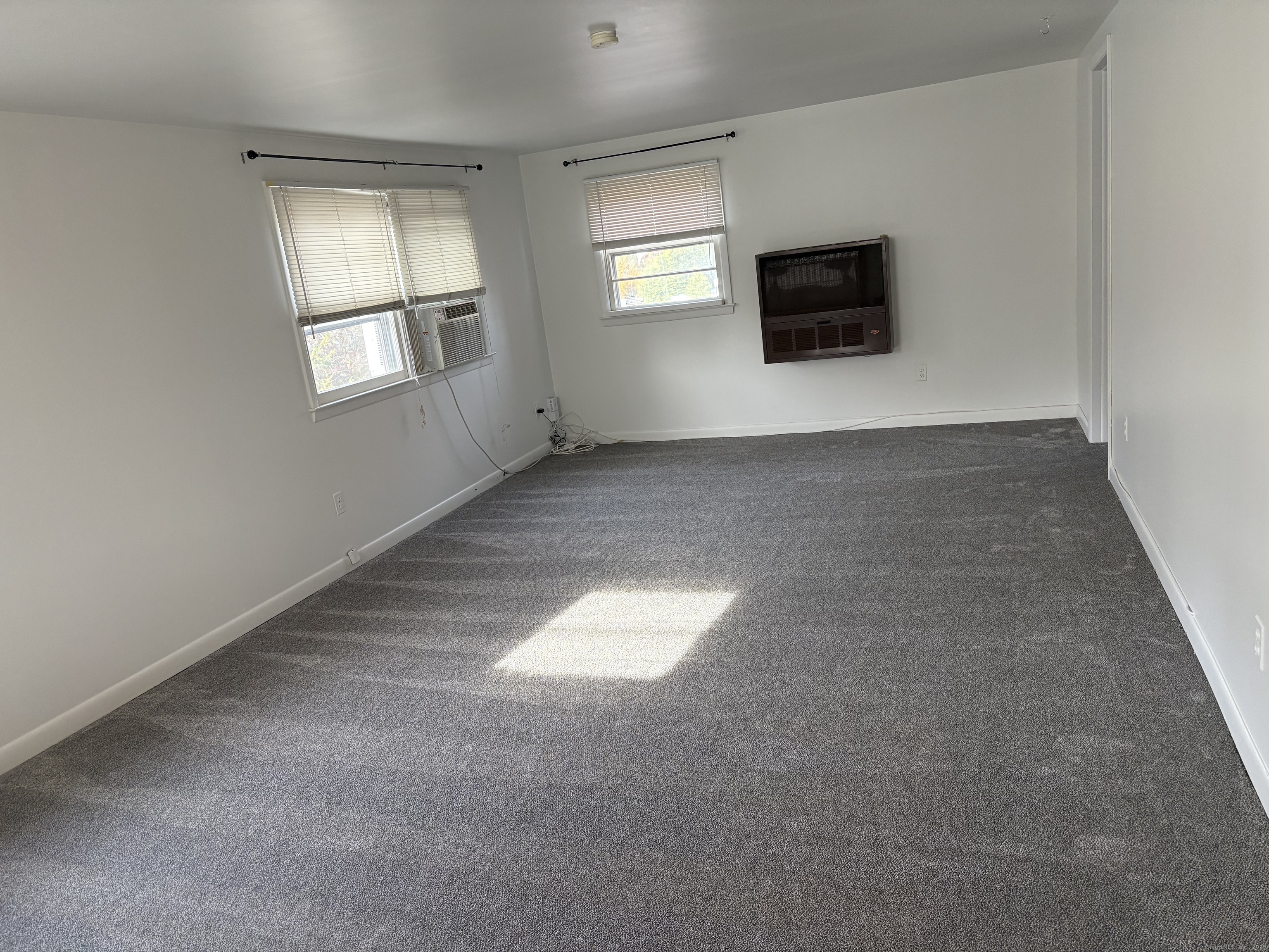 255 Fairfield Woods Road Fairfield, CT 06825 - Photo 18 of 22 a view of empty room with a flat screen tv