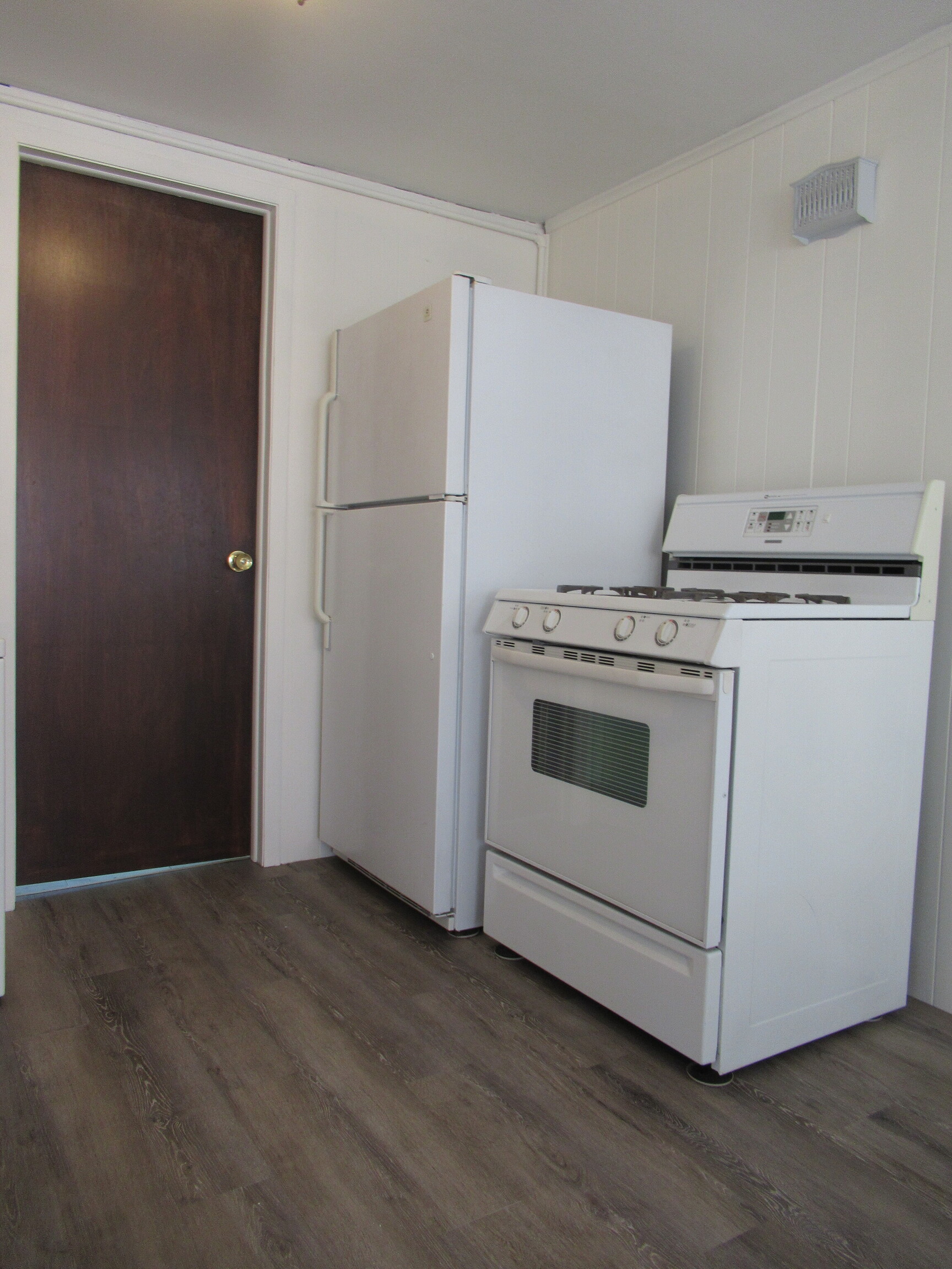 255 Fairfield Woods Road Fairfield, CT 06825 - Photo 9 of 22 a kitchen with a stove top oven and white door