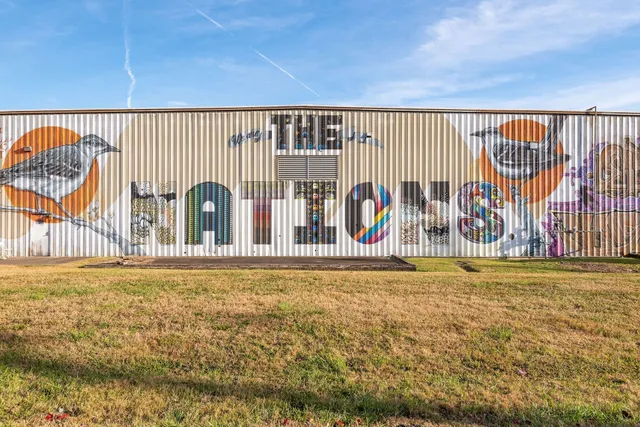 a picture of a bathroom with a shower and a mirror