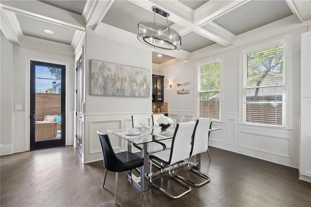 a view of a dining room with furniture and window