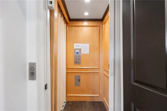 a bedroom with a bed and a fireplace