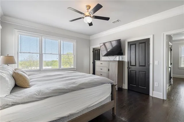a bathroom with a toilet and a shower curtain