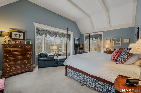 a bedroom with a bed and dresser