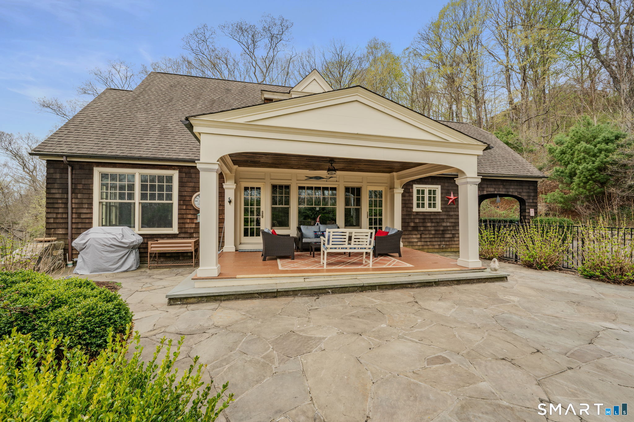 108 Westbrook Road Essex, CT 06409 - Photo 5 of 40 a front view of a house with garden and porch