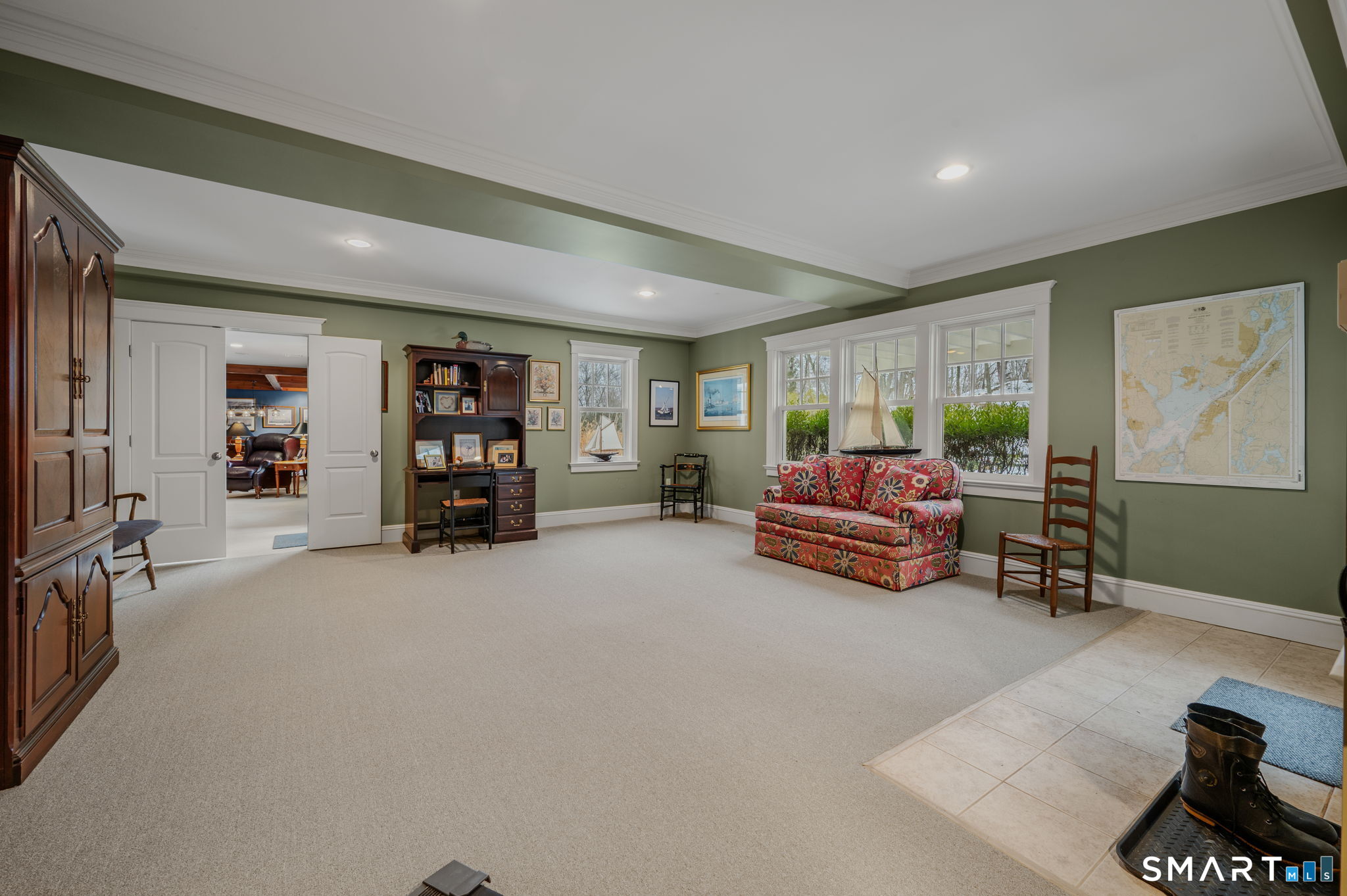 108 Westbrook Road Essex, CT 06409 - Photo 10 of 40 a living room with furniture and a large window
