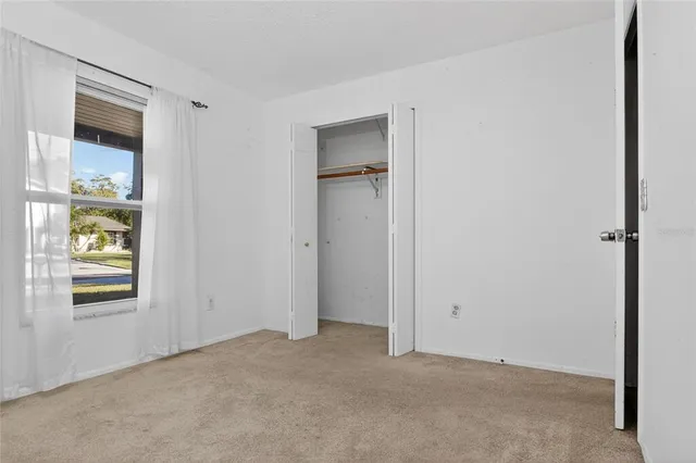 an empty room that has a window