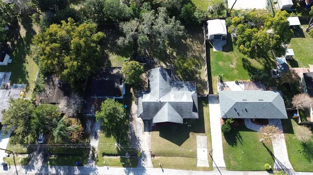 an aerial view of multiple houses with yard