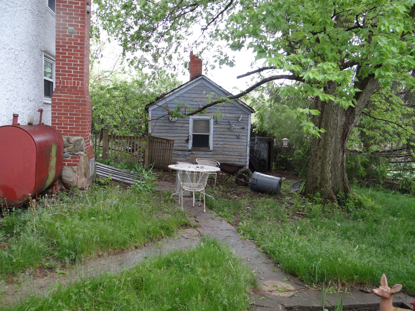 2529 Shaw Road West Brooklyn, IL 61378 - Photo 5 of 15 a view of a chair and table in backyard of the house