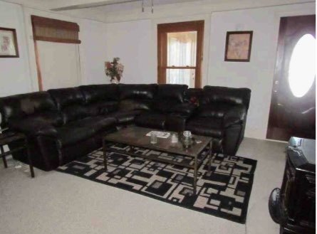 2529 Shaw Road West Brooklyn, IL 61378 - Photo 8 of 15 a living room with a couch and a fireplace