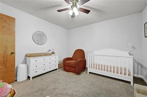 a bedroom with furniture and a window