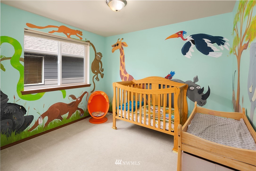 3425 183rd Place Southeast Bothell, WA 98012 - Photo 14 of 25 a bedroom with a bed and a window