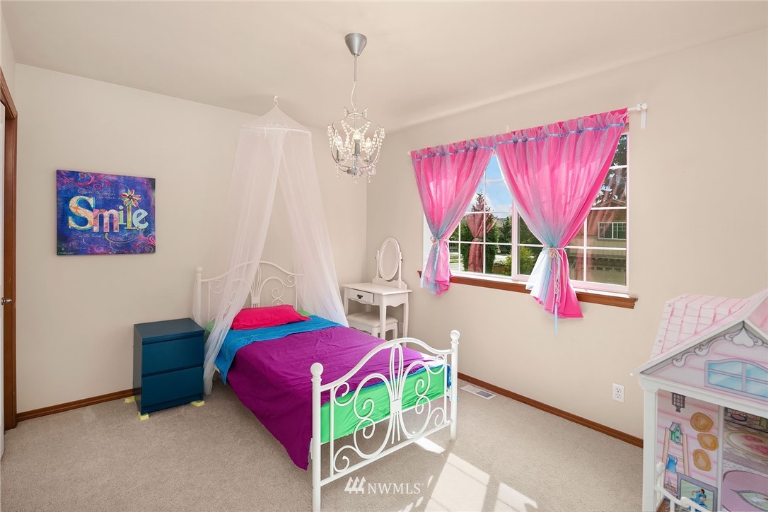 3425 183rd Place Southeast Bothell, WA 98012 - Photo 16 of 25 a living room with a bed furniture and a window