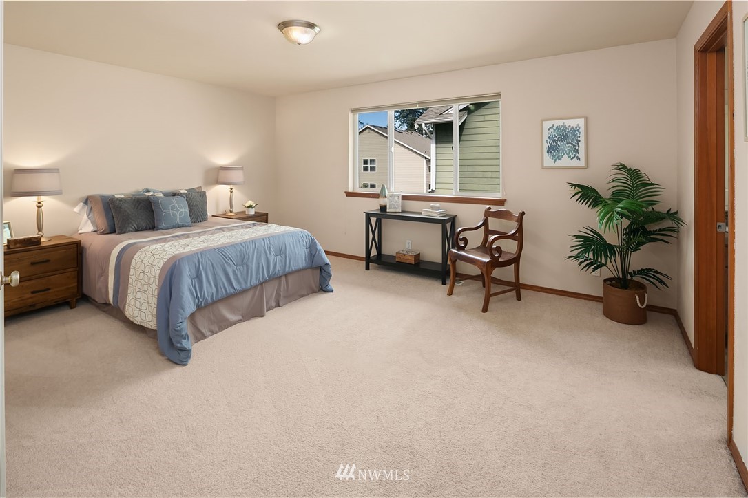 3425 183rd Place Southeast Bothell, WA 98012 - Photo 20 of 25 a spacious bedroom with a bed and a desk