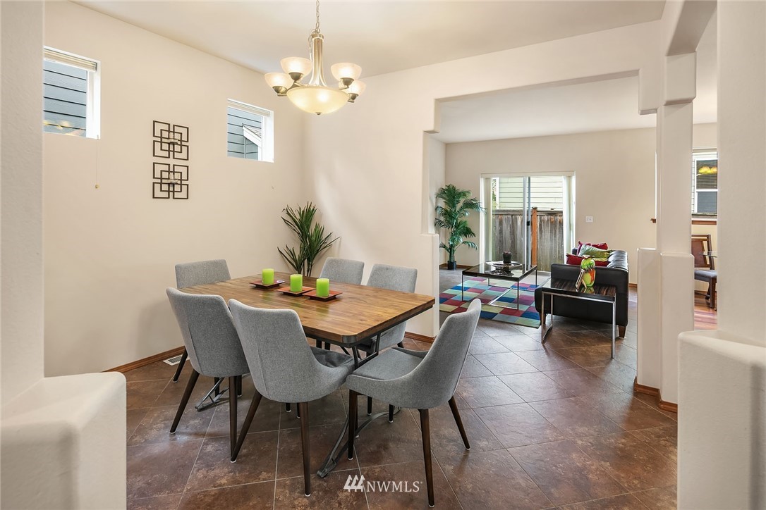 3425 183rd Place Southeast Bothell, WA 98012 - Photo 3 of 25 a view of a dining room with furniture and wooden floor