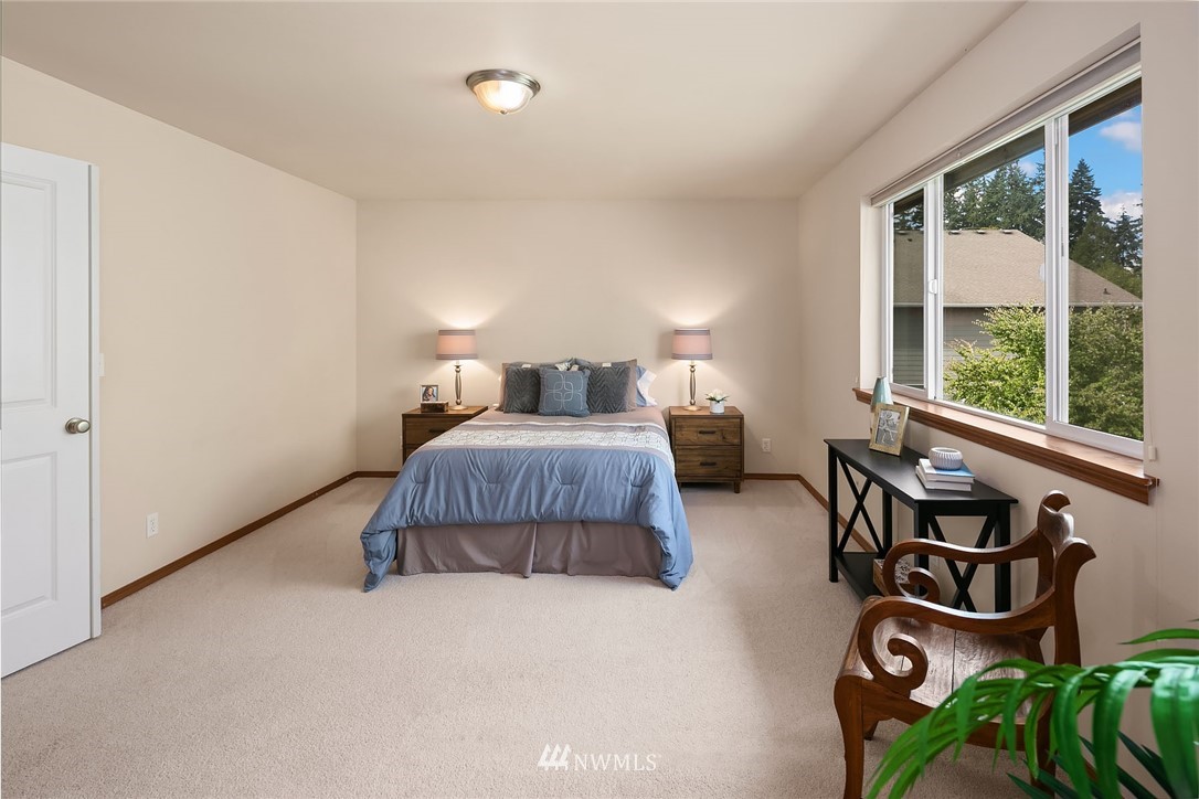 3425 183rd Place Southeast Bothell, WA 98012 - Photo 21 of 25 a bedroom with furniture and a window