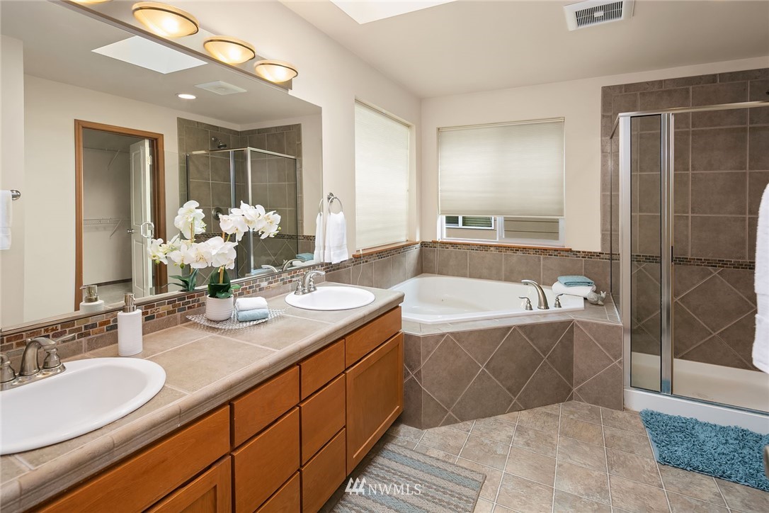 3425 183rd Place Southeast Bothell, WA 98012 - Photo 22 of 25 a bathroom with a tub sink and mirror