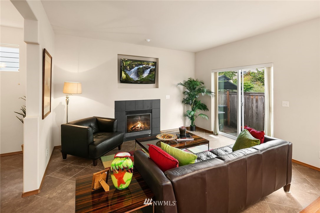 3425 183rd Place Southeast Bothell, WA 98012 - Photo 5 of 25 a living room with furniture fireplace and a large window