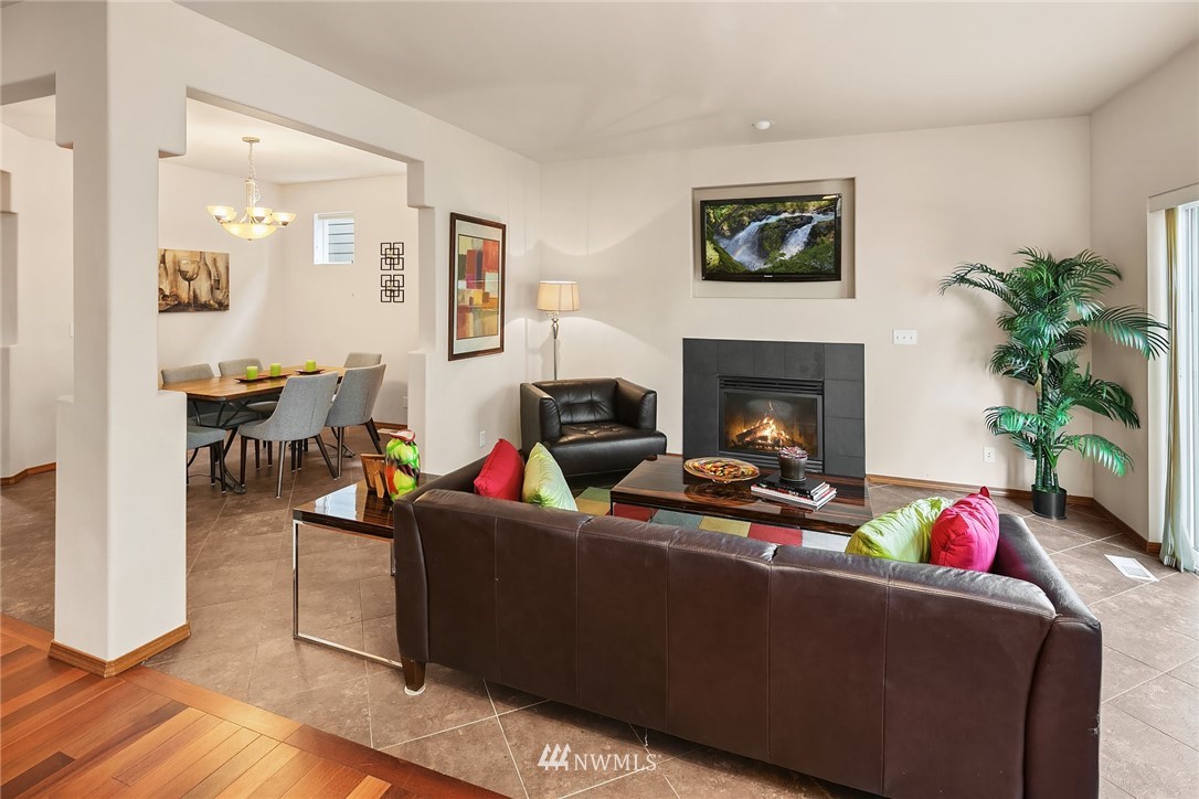 3425 183rd Place Southeast Bothell, WA 98012 - Photo 6 of 25 a living room with furniture potted plant and a fireplace