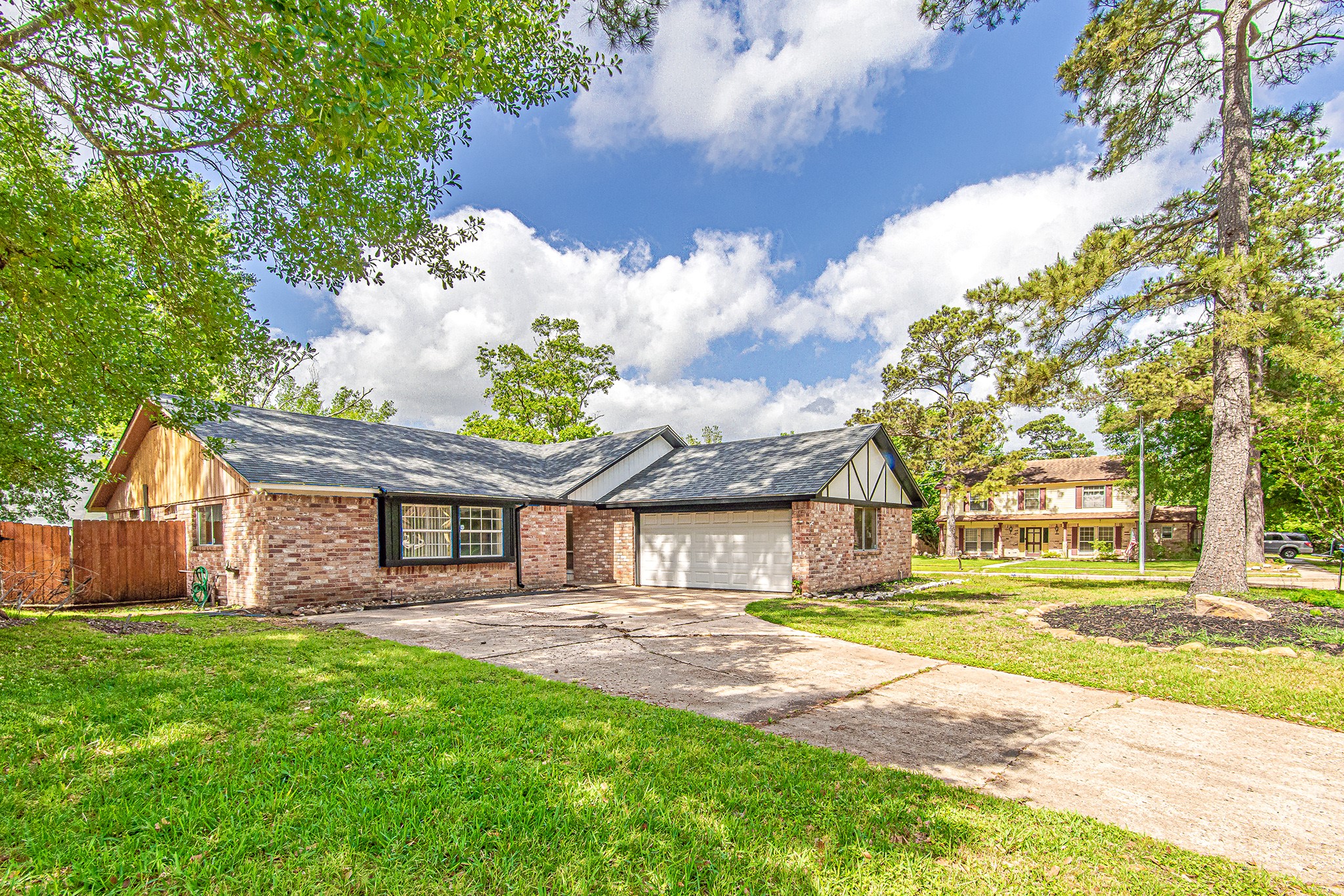 17811 Hawk Haven Lane Spring, TX 77379 - Photo 21 of 22 Extended driveway and wide frontage offer ample parking and a warm, inviting approach to the home.