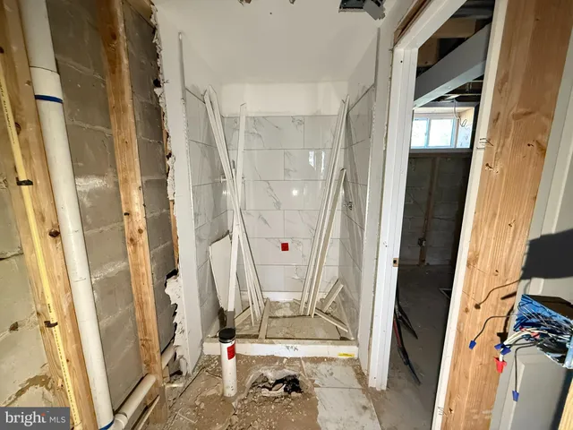 a view of an empty room with wooden walls