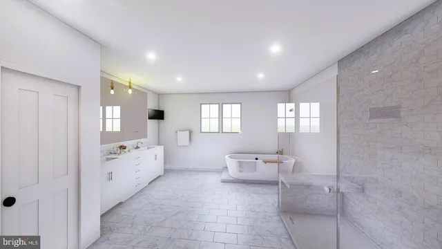 a large bathroom with a double vanity sink a mirror and a bathtub