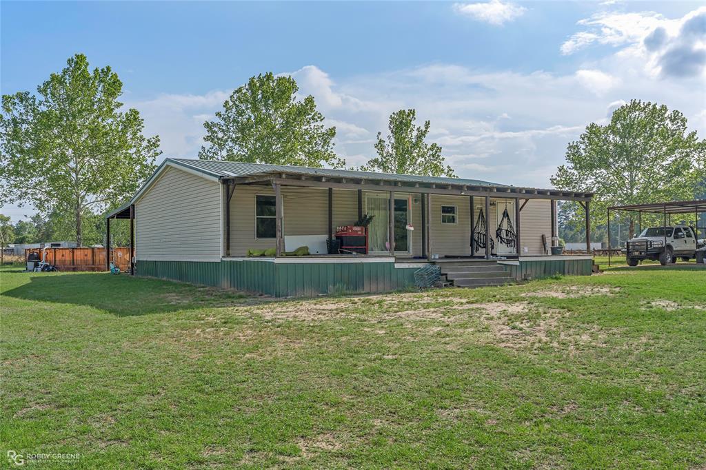 10660 Bowen Road Vivian, LA 71082 - Photo 18 of 27 a view of a house with a yard