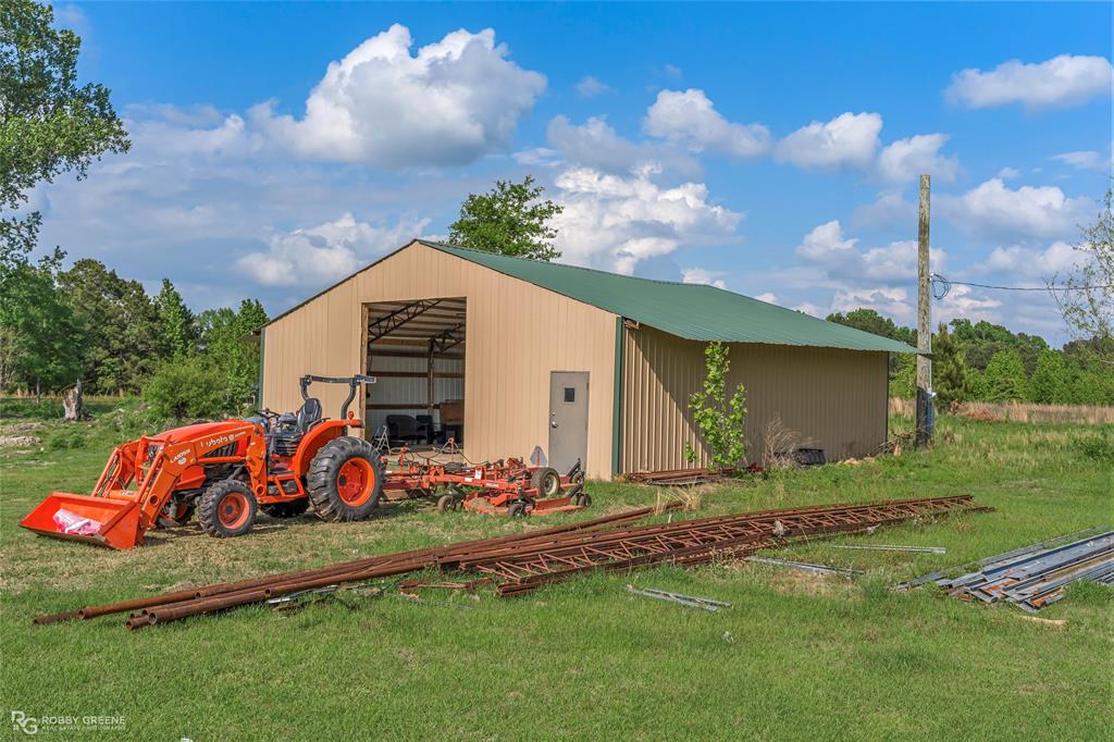 10660 Bowen Road Vivian, LA 71082 - Photo 21 of 27 a front view of a house with garden