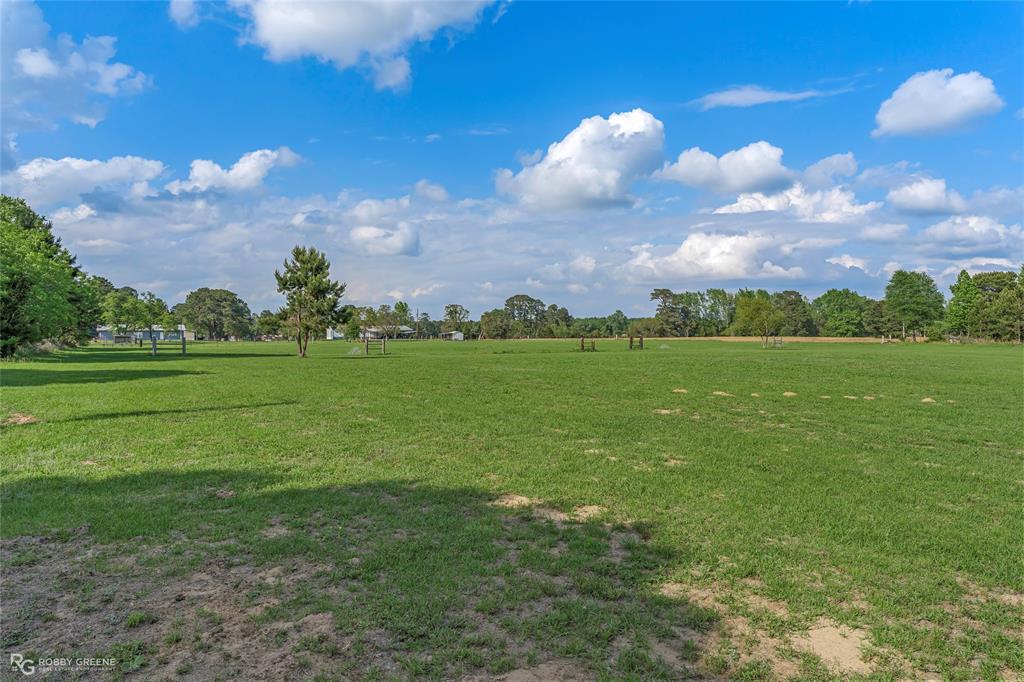 10660 Bowen Road Vivian, LA 71082 - Photo 26 of 27 a view of a golf course with a lake