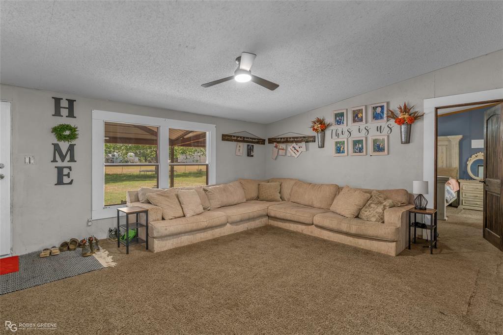 10660 Bowen Road Vivian, LA 71082 - Photo 4 of 27 a living room with furniture and a large window