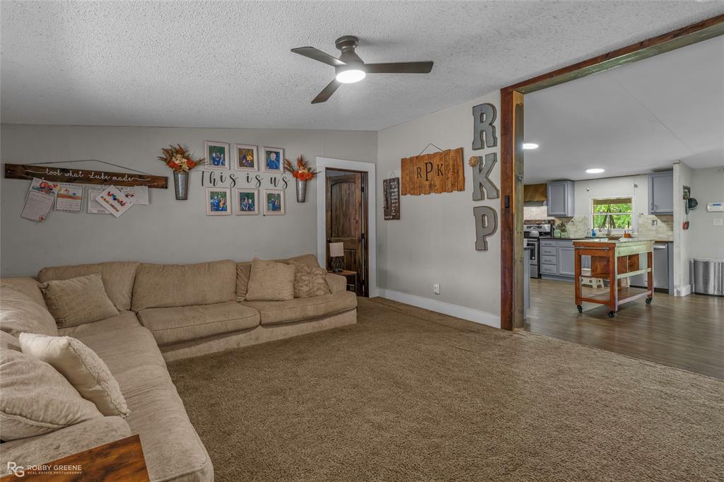10660 Bowen Road Vivian, LA 71082 - Photo 5 of 27 a living room with furniture and kitchen view