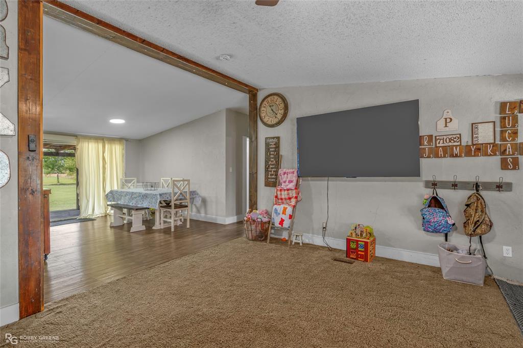 10660 Bowen Road Vivian, LA 71082 - Photo 7 of 27 a living room with furniture and a flat screen tv