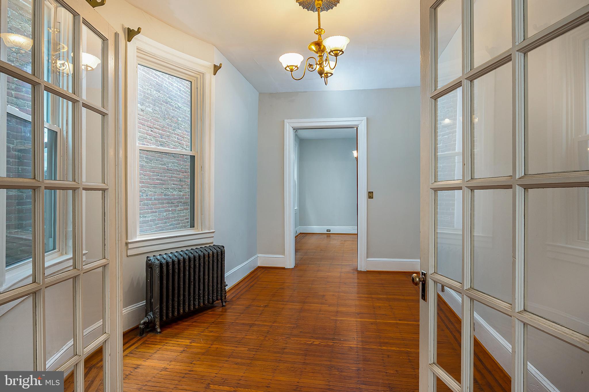 4018 Roland Avenue Baltimore, MD 21211 - Photo 7 of 27 a view of an entryway with wooden floor