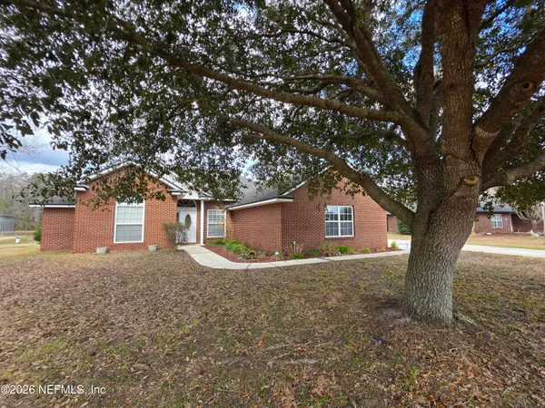 a house with a tree in front of it