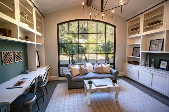 a view of a field with an trees in the background