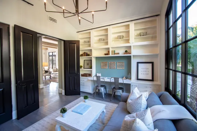 a backyard of a house with table and chairs