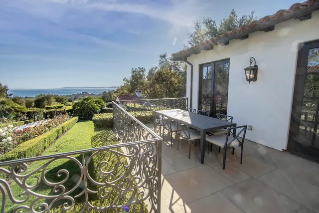 a white bath tub sitting in a bathroom next to a window