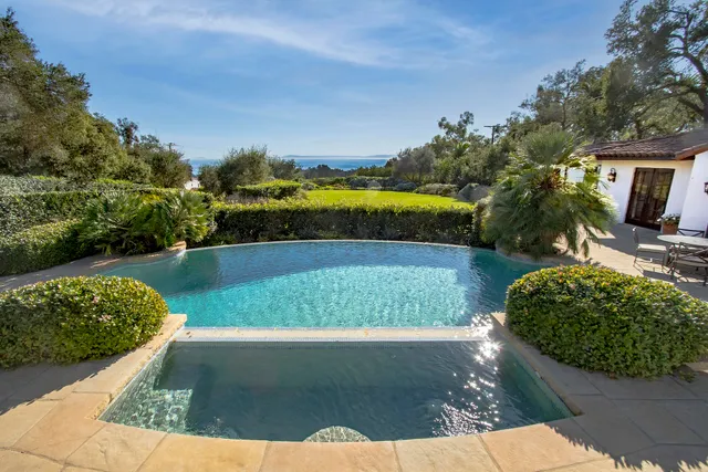 a bathroom with a sink a mirror and a shower