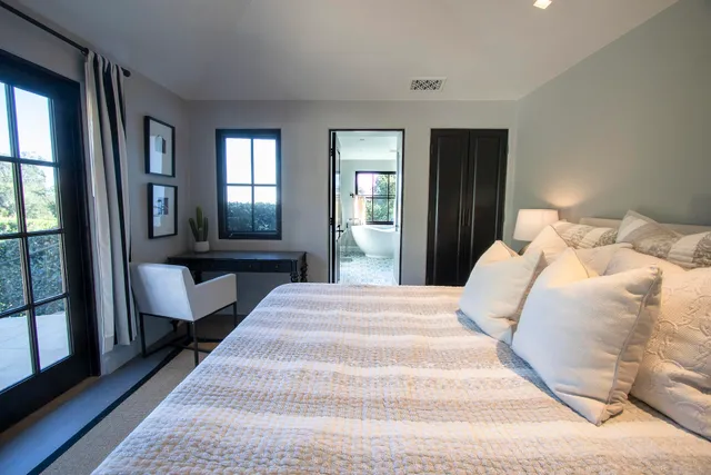 a view of a livingroom with furniture window and wooden floor