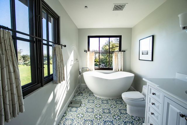 a bedroom with a bed and a lamp