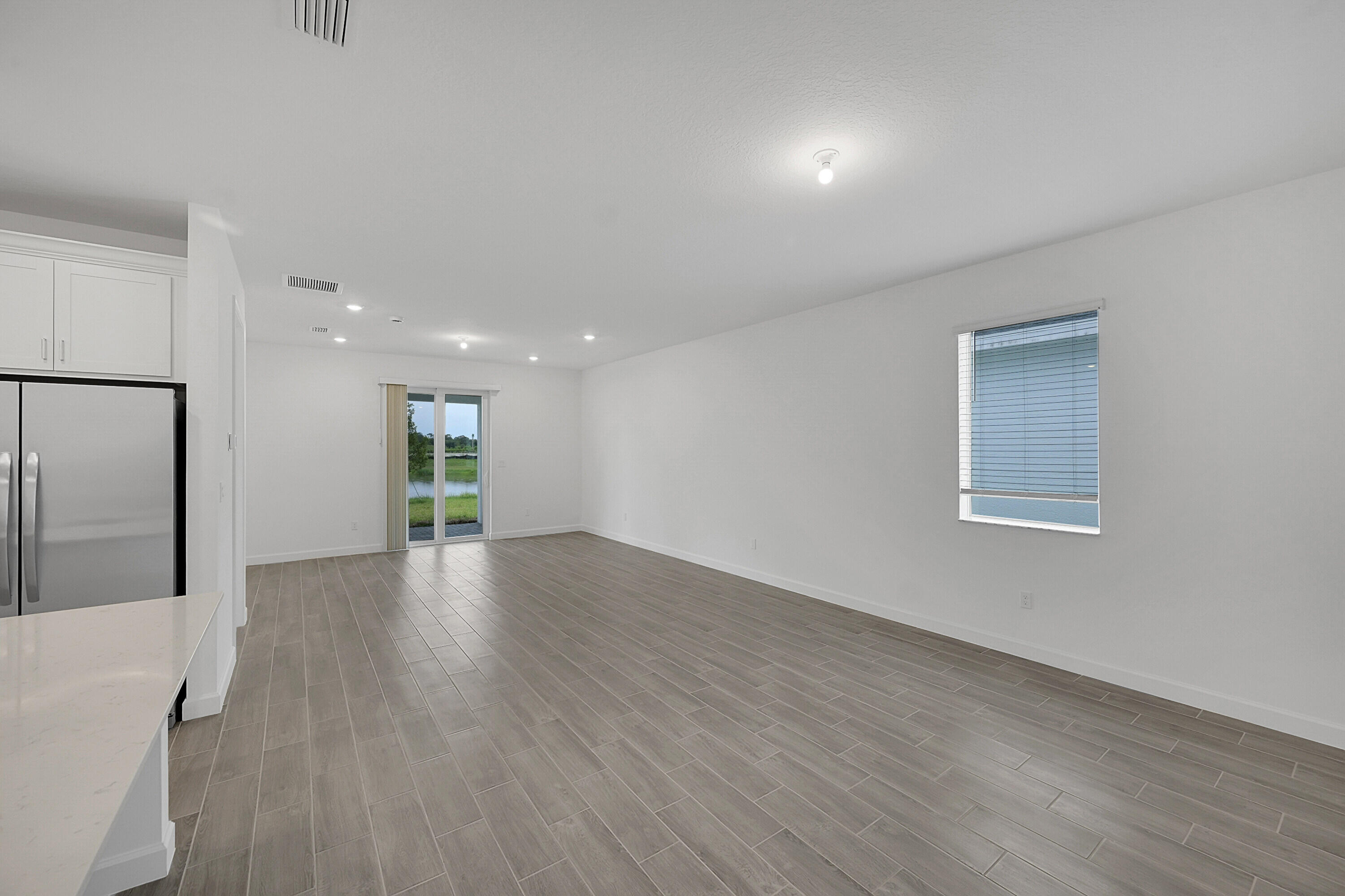 3550 Angler Drive Fort Pierce, FL 34946 - Photo 8 of 31 a view of a hallway with wooden floor