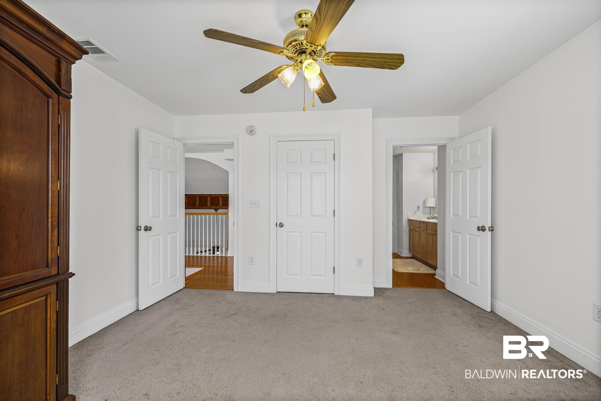 32875 Faircloth Road Lillian, AL 36549 - Photo 49 of 85 Unfurnished bedroom with light colored carpet and a ceiling fan