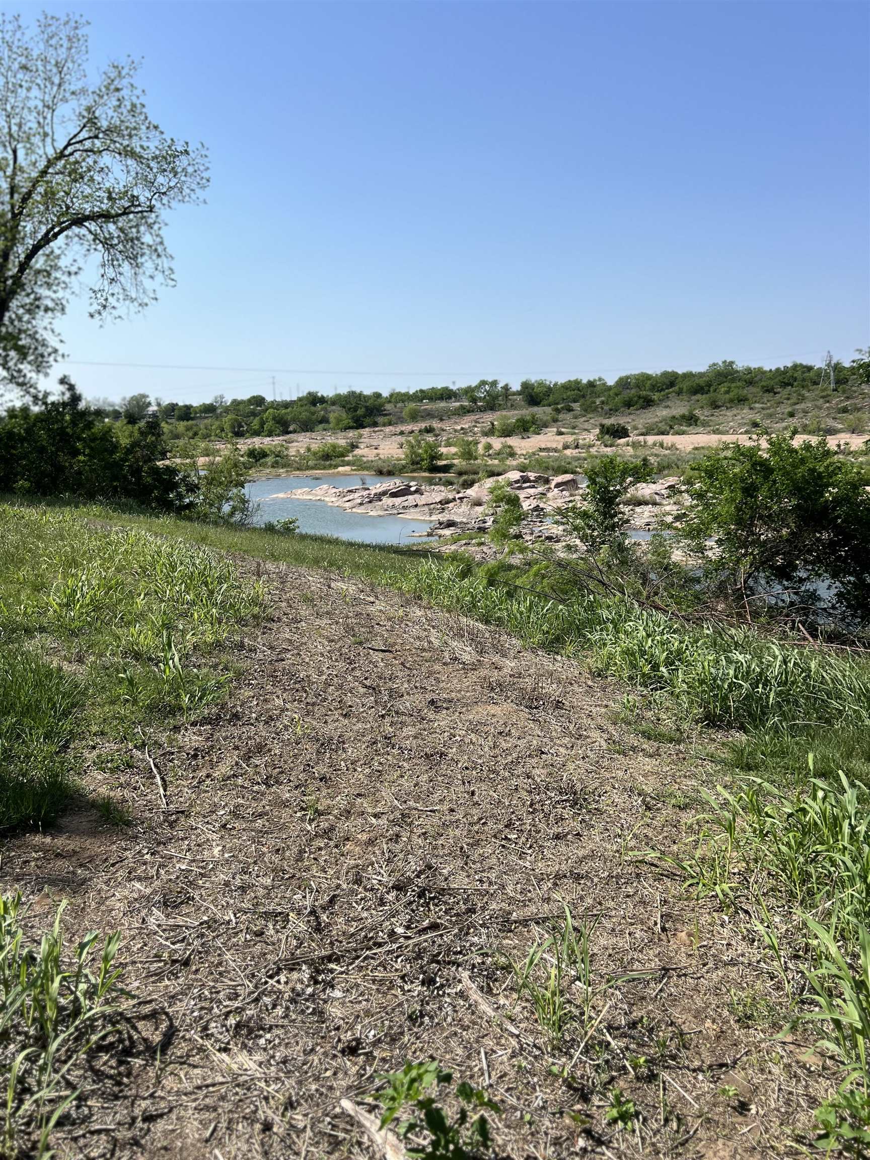 609 East Main Street Llano, TX 78643 - Photo 12 of 24 a view of a lake with houses in the back