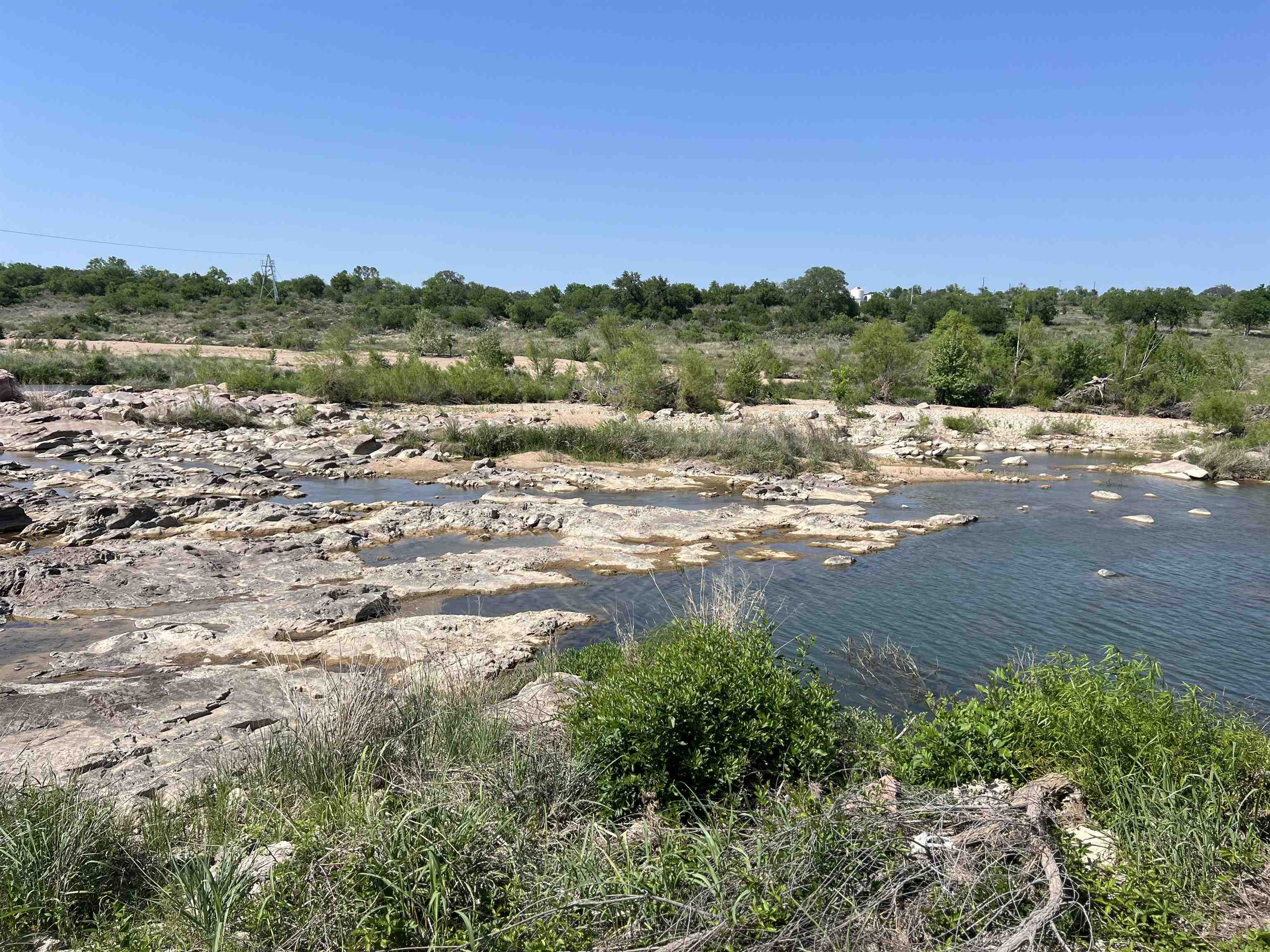 609 East Main Street Llano, TX 78643 - Photo 6 of 24 a view of a lake with beach and city view