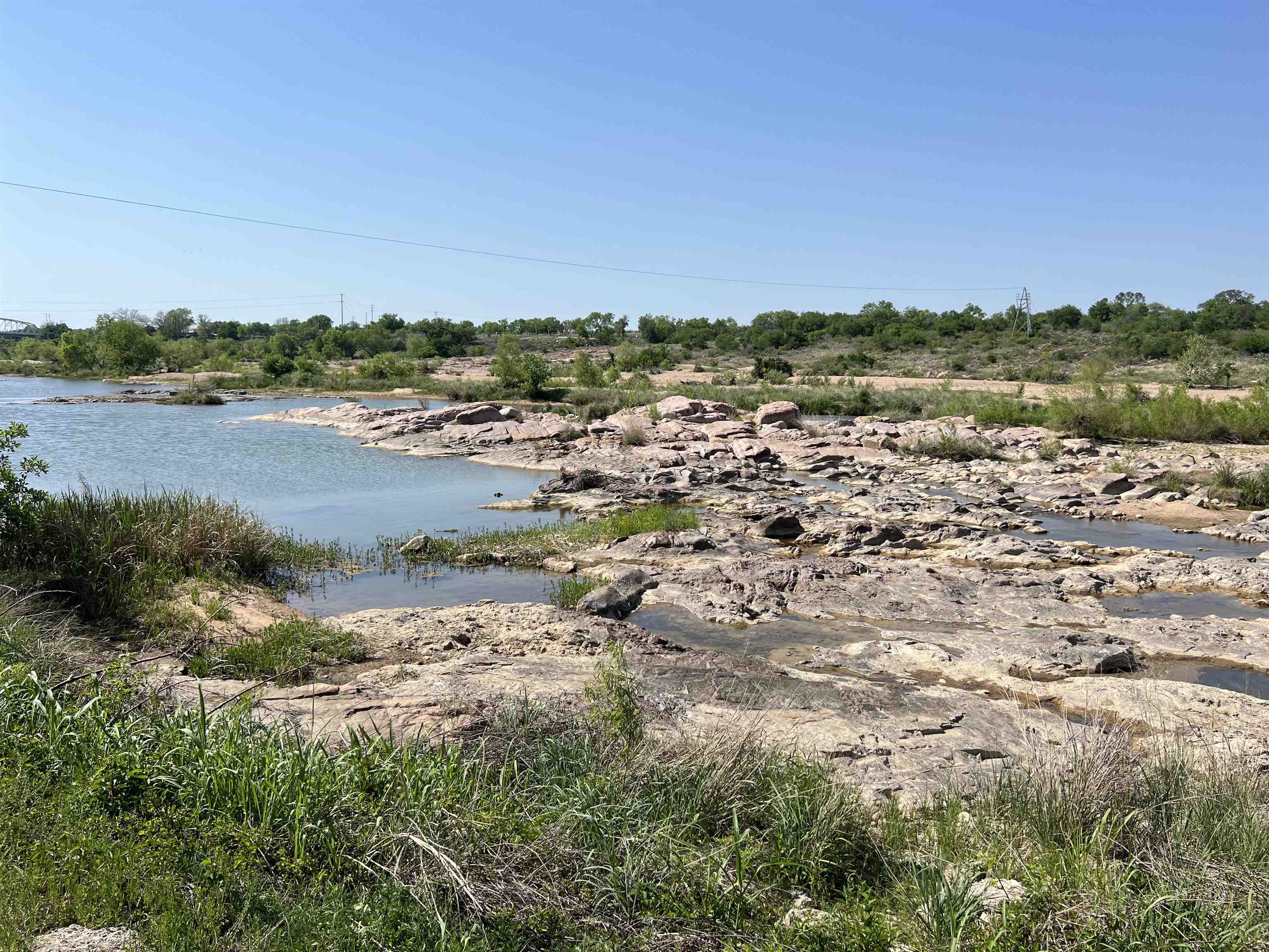 609 East Main Street Llano, TX 78643 - Photo 7 of 24 a view of a lake with beach and city view