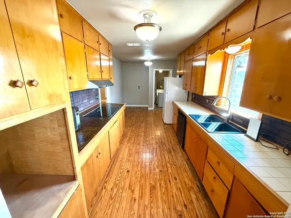 a spacious bathroom with a sink and a mirror