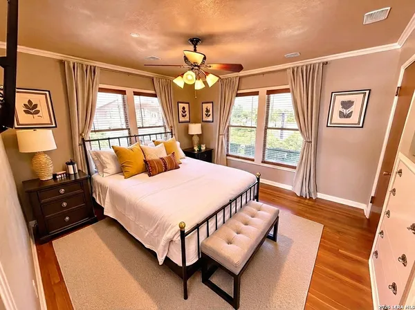 a bedroom with a large bed and a window